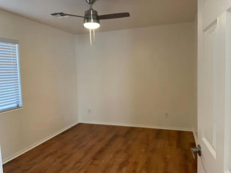 Downstairs bedroom with walk in closet.