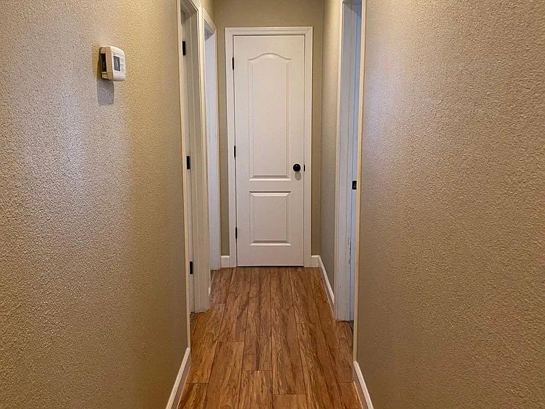 hallway with the view of the linen closet.