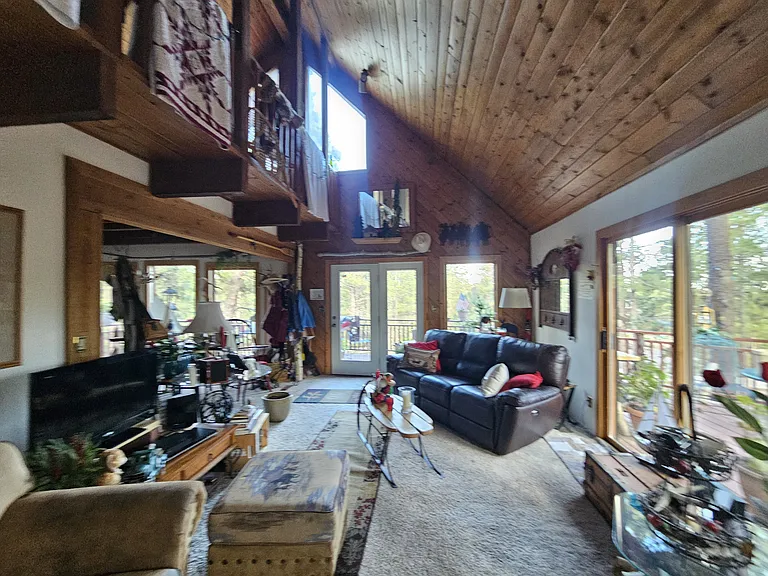 2nd floor of home. We share this; besides you have the third floor living room and office all to yourself! The 2nd floor has a large wrap around deck buried in woods. Fully furnished.