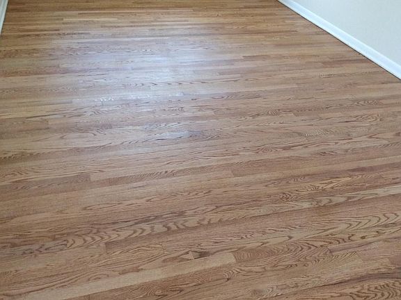 Bedroom with refinished wood floors