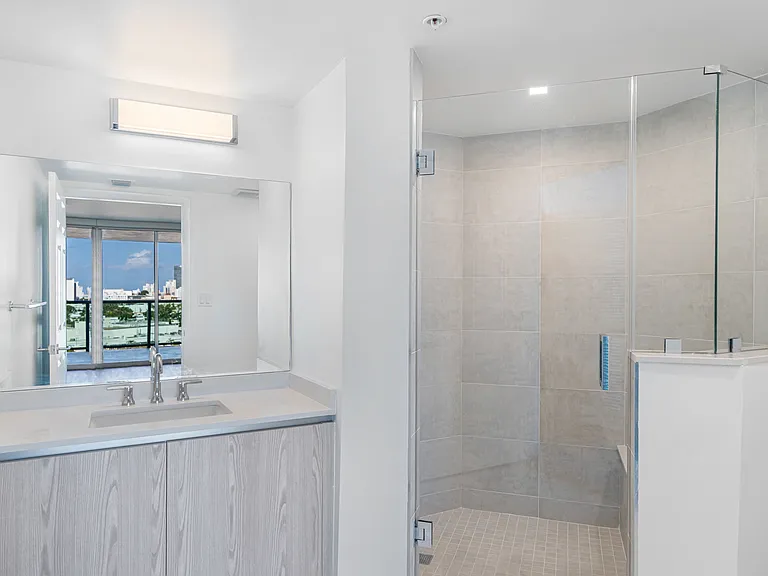 Bathrooms with plenty of storage and walk-in showers