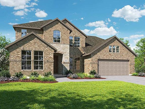 Elevation C is a traditional two story brick and stone home design with arched entry at front porch.
