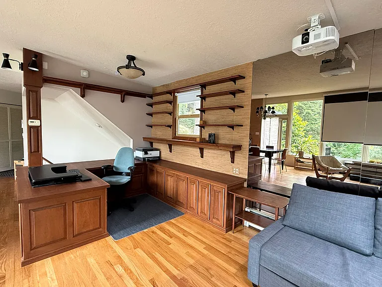 Built in desk / office with floor to ceiling mirrors on back wall