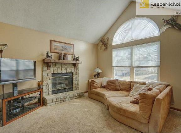 Great room w/ gas stone fireplace.