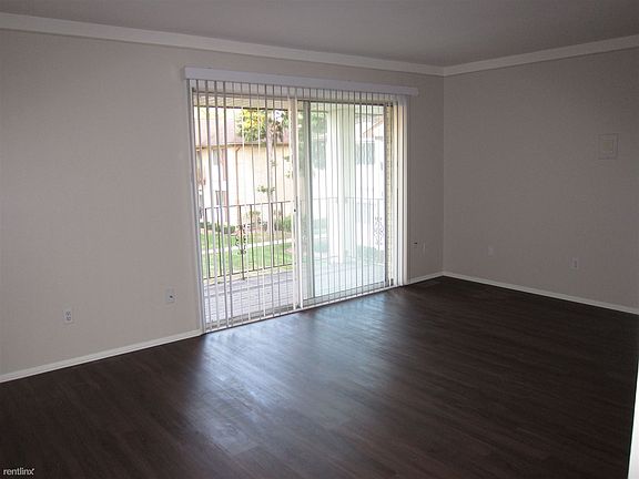 Living room with doorwall to balcony.