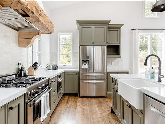 french fridge, 30" farm sink, and 5 burner bertazzoni Italian range invite you to enjoy cooking