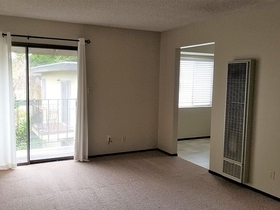 Living room with a new wall heater.