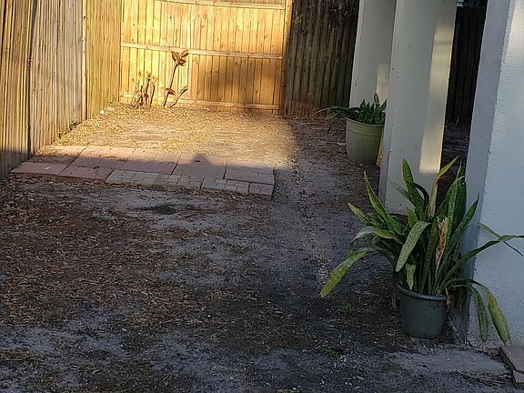 Access to garage under bedroom for laundry hook up.