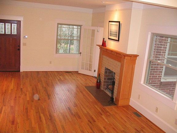 Living room features a wood-burning fireplace - office off living room.