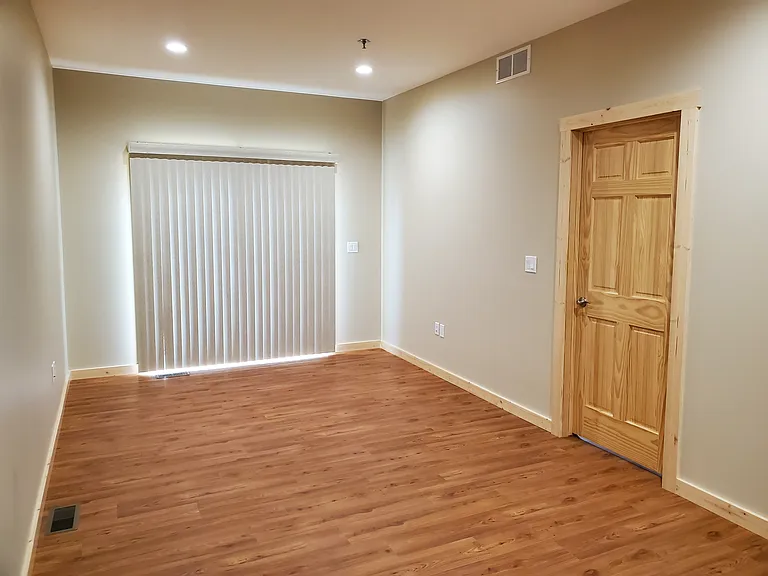 living room with sliding glass door to back deck