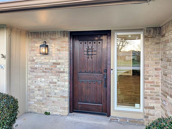 Front entry with natural mahogany door with biometric lock