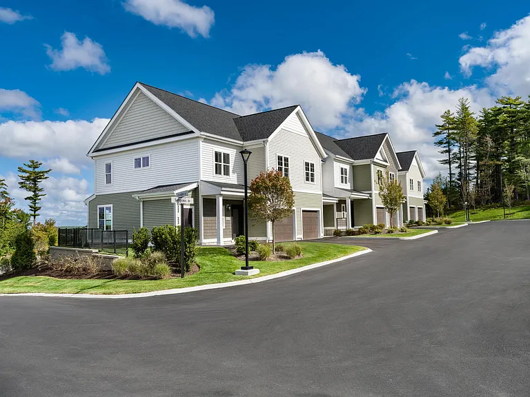 Townhome-style apartment homes with attached garages offer added privacy within this idyllic South Shore community.