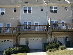 REAR ENTRY ONE CAR GARAGE WITH AUTOMATIC OPENER