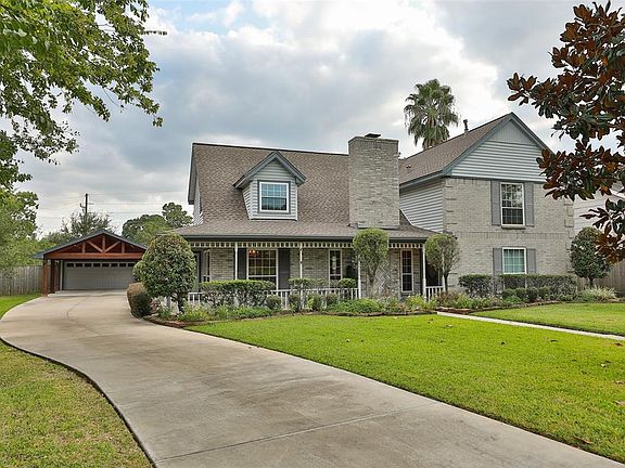Long driveway provides plenty of room for guests to park plus there is a finished out 2 car garage and a fabulous two-car cedar porte cochere with power.