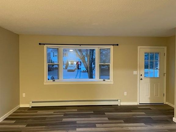 Front door and bay window, coat closet to the right, just out of the picture