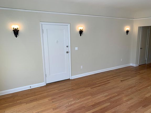 LIVING ROOM WITH ORIGINAL REFINISHED SCONCES