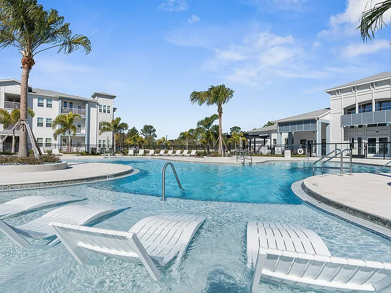 Experience the ultimate in relaxation and style by the luxurious poolside at our modern apartments.