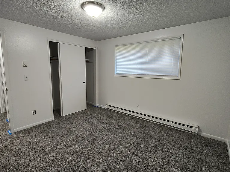2nd Bedroom - New light fixture, new window treatments, new paint and carpet