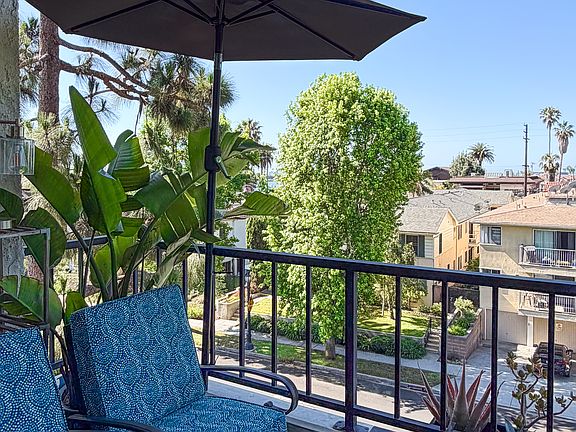 Tree-lined coastal views from private balcony