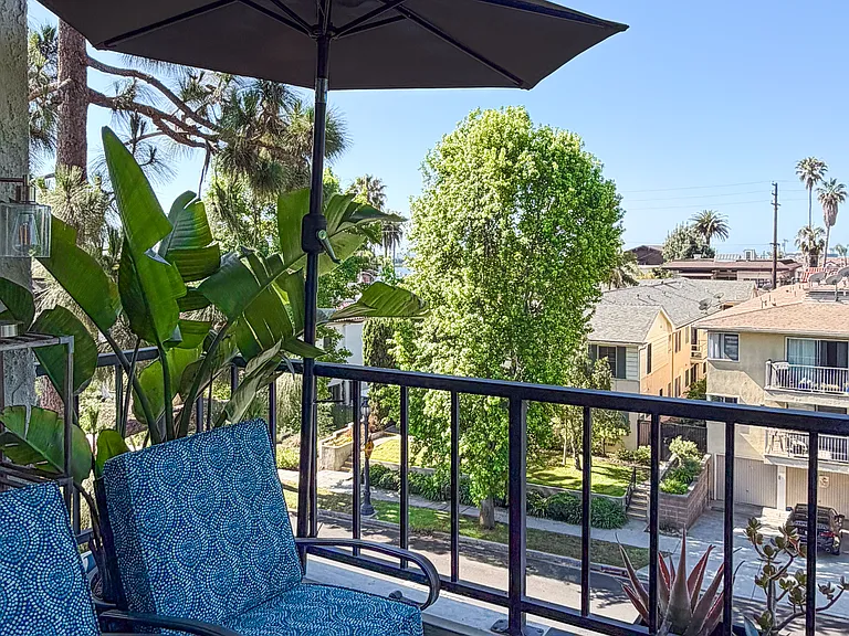 Tree-lined coastal views from private balcony