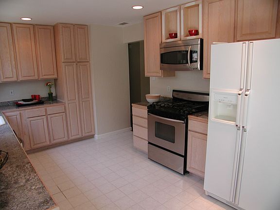 Granite countertops, dishwasher, disposal, gas oven, microwave and refrigerato