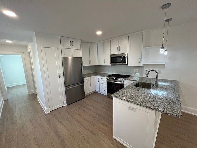 Kitchen with brand new stainless appliances and plenty of storage.