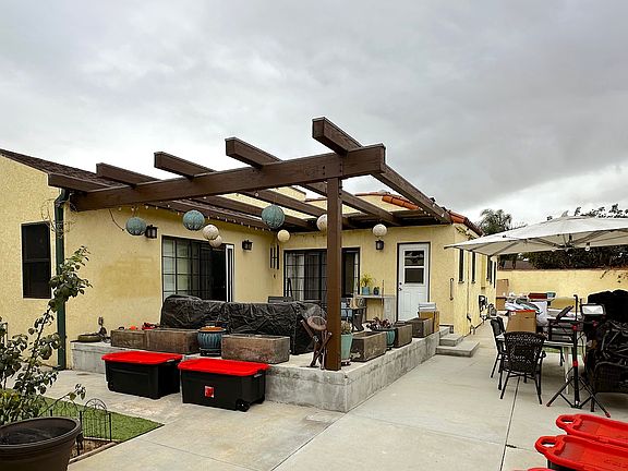 great back patio for BBQ, entertaining, enjoying the stars at night and relaxing. Accessible from kitchen and two of the bedrooms.
