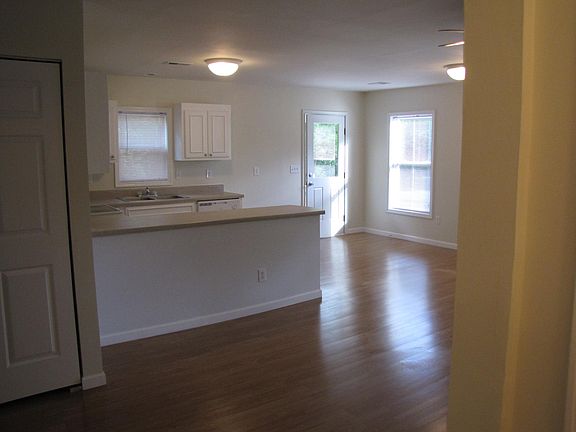 Living area and kitchen facing side door