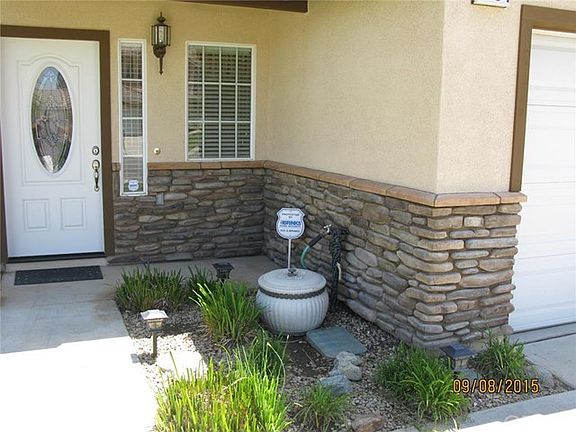 Front Exterior View 2- Custom entry door, stone accents and curb appeal.