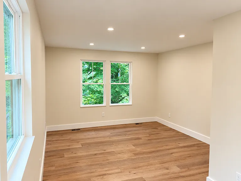 Private primary bedroom provides a peaceful retreat with generous proportions and excellent separation from the main living areas.