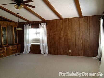 Formal dining room and living room : Formal dining has built-in lighted buffet for your precious tre