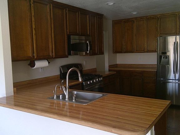 Stainless steel refrigerator, microwave gas stove/oven and dishwasher