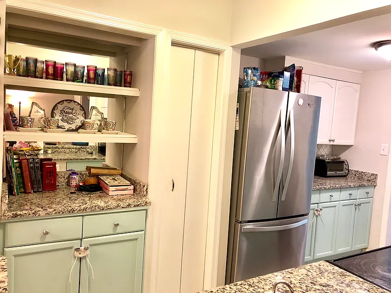 Open galley kitchen with pantry, Whirlpool French-door fridge and dishwasher