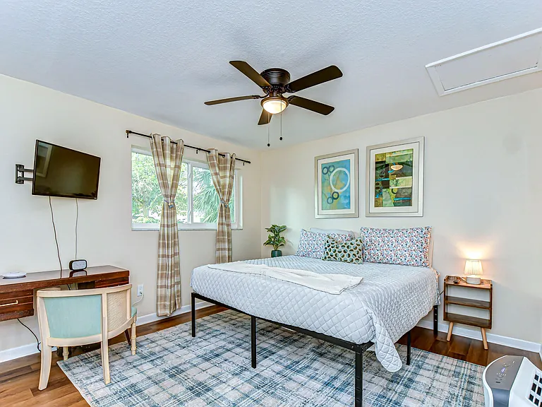 The bedroom features a 32" smart tv, large and comfortable king bed and a walk in closet and ensuite bathroom