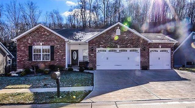 Stunning home with lead glass front door,  full brick / three garage and driveway.