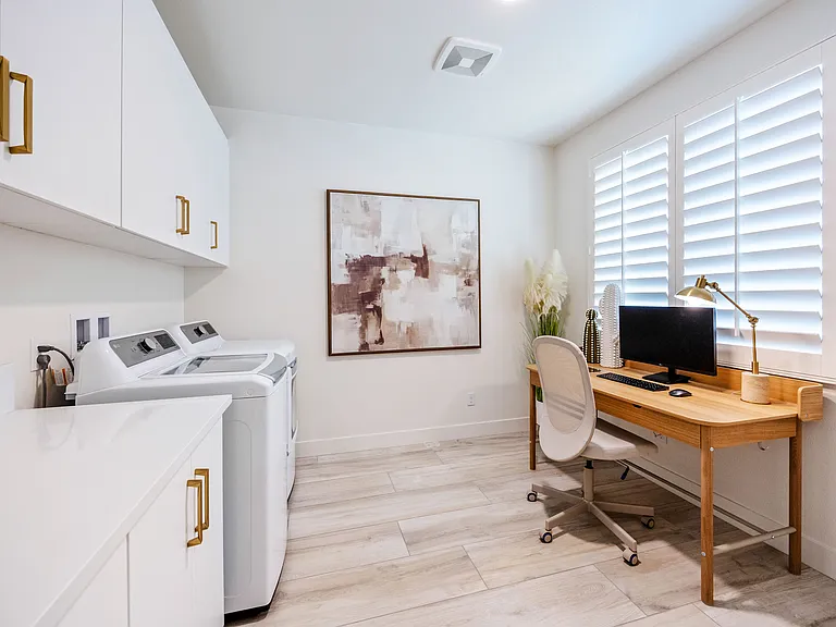 The laundry room doubles as a private working station and is equipped with a large desk recline feature office chair, 27-inch HP monitor, wireless keyboard, mouse, lamp, and backpack hooks for all your needs!
