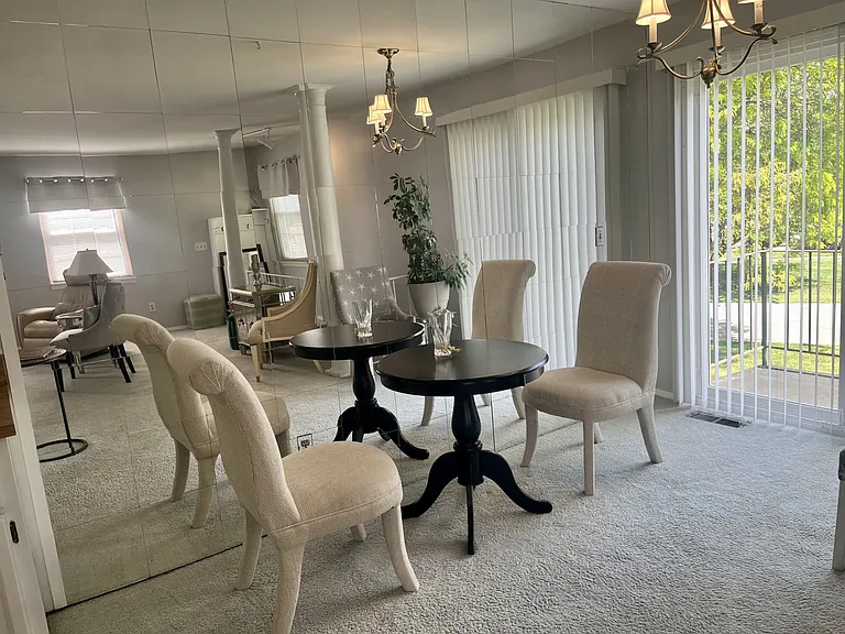 Dining space with doorwall to balcony