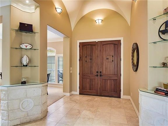 Soaring groin ceilings and travertine floors welcome you in the foyer.