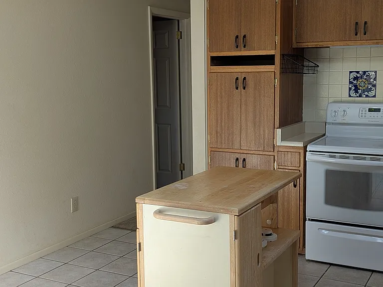 space for table or Microwave stand in kitchen. Island included. A microwave included