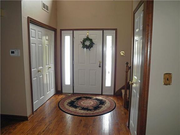 Hardwood two story entrahce hall