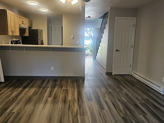 living room looking into kitchen & entry