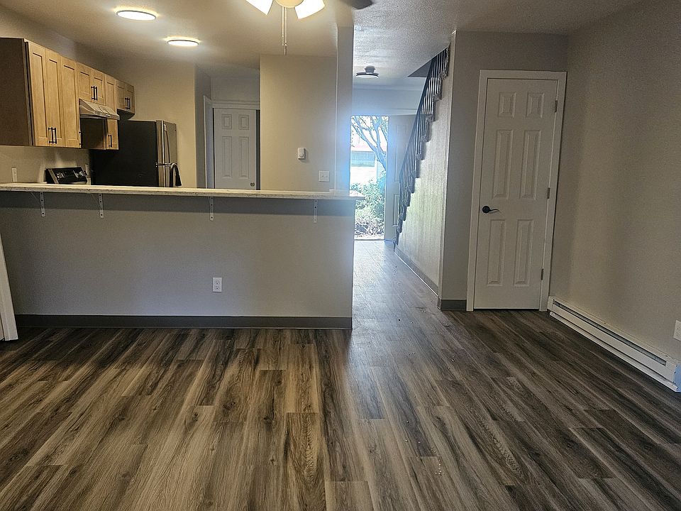 living room looking into kitchen & entry