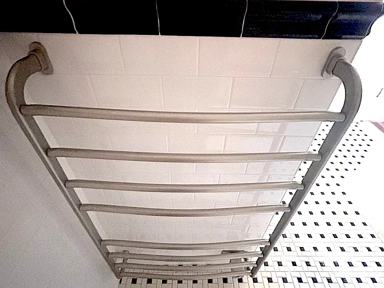 Rear bathroom warming towel rack