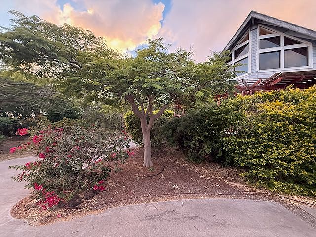 Front of the house with shared horseshoe driveway