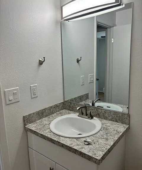 Experience sophistication with this elegant bathroom design, featuring a stylish vanity. Experience sophistication with this elegant bathroom design, featuring a stylish vanity.