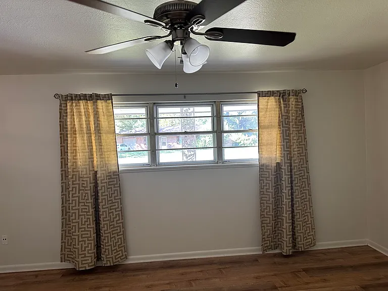 Living room interior with a view of the front window.