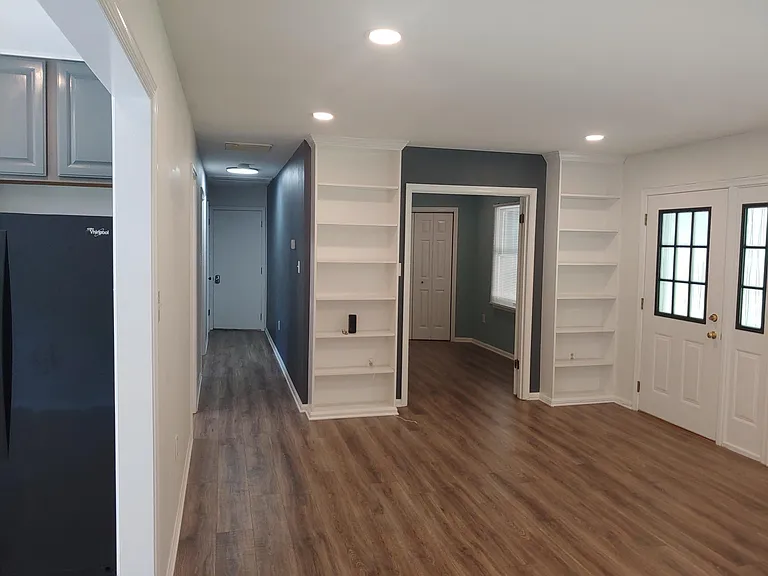 Apartment has a front door, kitchen door, and door to the garage.