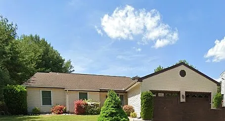 Front of home, meticulously landscaped with 2-Car Garage!