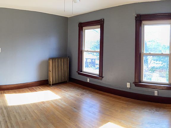 Opposite end of living room with bathroom entry door.