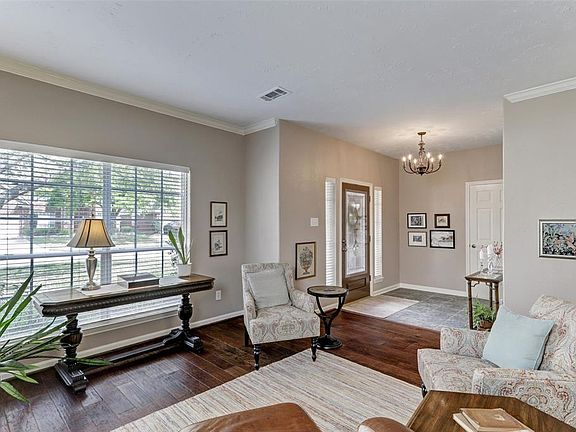 Great natural light across the formal living room from large window.